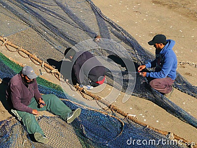 Fishermen in the harbour of Essaouira, Morocco Editorial Stock Photo