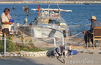 Fishermen mending their nets Editorial Stock Photo