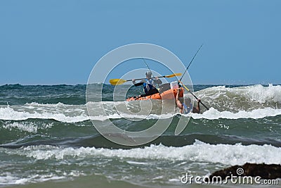 Fishermen With Ocean Kayak In The Waves Editorial Stock Photo