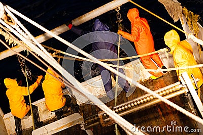 Fishermen pull the trawl to fish at night Stock Photo