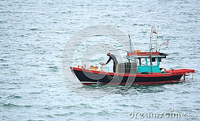 Fishermen on Small fishing boats near the island. Editorial Stock Photo