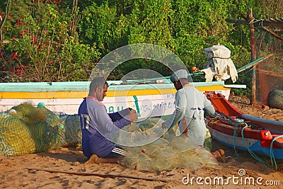 Fishermen Taking out fish from their gill net in Tamil Nadu, India Editorial Stock Photo