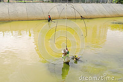 Fishermen using square nets called Yo to catch fish,Fishermen are catching fish with yo. Editorial Stock Photo
