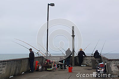 Fishermen Waiting on the Pier Editorial Stock Photo