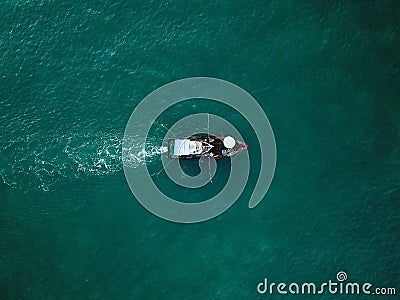 Fishermen workplace, fisher boat shot with a drone, down facing shot, drone only, fishing in the Pacific Ocean, sea fishing backgr Stock Photo