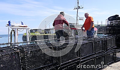 Fishermen Wrasse fishing pots on Fishing boat in Carnlough Antrim Northern Ireland 14-07-21 Editorial Stock Photo