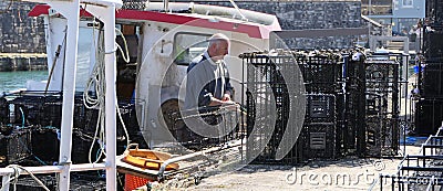 Fishermen Wrasse fishing pots on Fishing boat in Carnlough Antrim Northern Ireland 14-07-21 Editorial Stock Photo