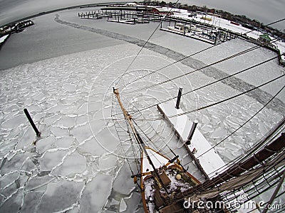 Fisheye aerial view from aloft on tallship in ice Stock Photo