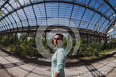 Fisheye portrait of short hair girl in an abandoned factory Stock Photo