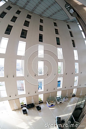 Fisheye shot of atrium of office with tall pillars and a huge open space Editorial Stock Photo