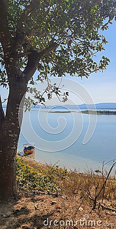 Fishing boat anchored at shore in Kaptai lake Hill tracts of Chittagong Stock Photo