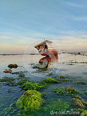 Fishing boat on the beach Stock Photo