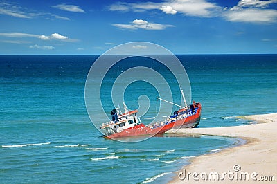 Fishing boat beached Stock Photo