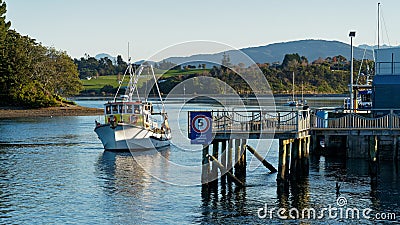 A fishing boat docking at Port Motueka Editorial Stock Photo
