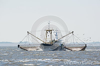 Fishing boat on Dutch wadden sea Stock Photo