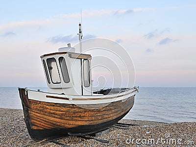 Fishing boat on gravel beach Stock Photo