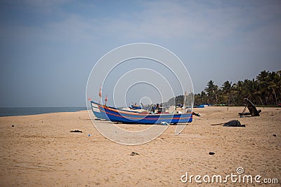 Fishing boat of Indian fishermen on the sandy beach in Kerala, fishing village Marari Editorial Stock Photo