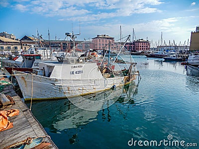 Fishing boat moored in the port of Genoa Genova, Italy. Editorial Stock Photo