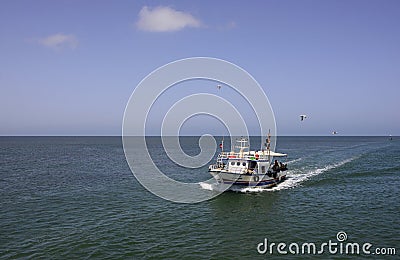 Fishing Boat Returning from Toil, Mediterranean Sea Fishermen Editorial Stock Photo