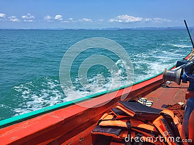 A boat in the blue sea Stock Photo