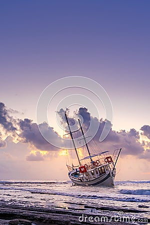 Fishing boat shipwreck or abandoned shipwreck. , Wrecked boat abandoned stand on beach in RHodes Stock Photo