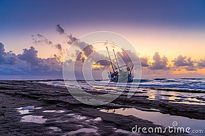 Fishing boat shipwreck or abandoned shipwreck. , Wrecked boat abandoned stand on beach in RHodes Stock Photo