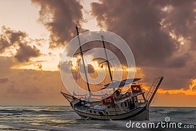 Fishing boat shipwreck or abandoned shipwreck. , Wrecked boat abandoned stand on beach in RHodes Stock Photo