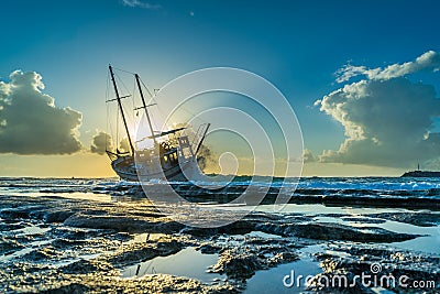 Fishing boat shipwreck or abandoned shipwreck. , Wrecked boat abandoned stand on beach in RHodes Stock Photo