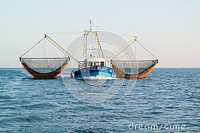 Fishing boat or shrimp trawler fishing on Waddensea, Netherlands Editorial Stock Photo