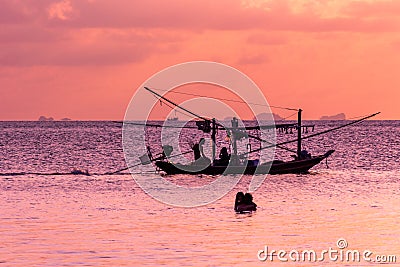 Fishing boat silouhette at sunset Editorial Stock Photo