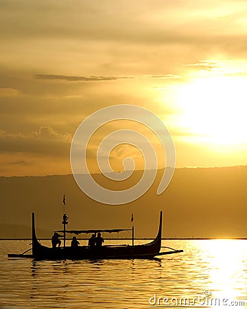 Fishing Boat at Sunset Stock Photo