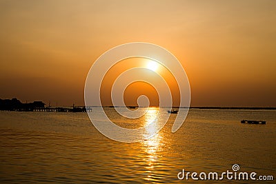 Fishing boat at sunset and Oyster farm. Chonburi Thailand. Stock Photo