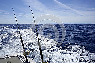 Fishing on the boat with trolling rod and reel. Stock Photo