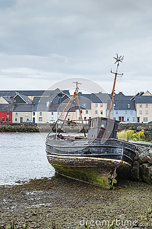 Fishing boat wreck in Claddagh port of Galway, Ireland. Editorial Stock Photo