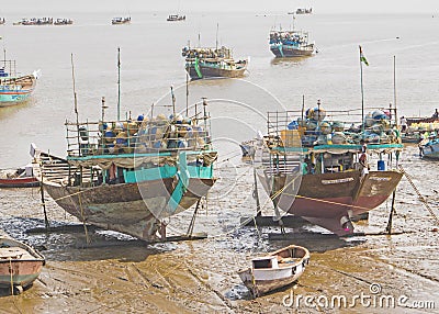 Docked Indian Wooden Fishing Boats at Low Tide Editorial Stock Photo