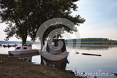 Fishing boats anchored on Danube river Editorial Stock Photo