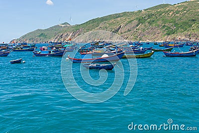 Fishing boats are anchored at the pier in the morning on the blue seawater at Quy Nhon, Vietnam June 2022 Editorial Stock Photo