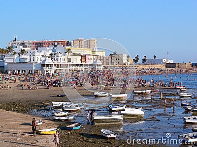 Fishing boats on the beach of La Caleta in the bay of the capital of Cadiz, Andalusia. Spain. Editorial Stock Photo