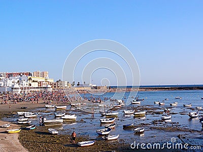 Fishing boats on the beach of La Caleta in the bay of the capital of Cadiz, Andalusia. Spain. Editorial Stock Photo