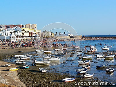 Fishing boats on the beach of La Caleta in the bay of the capital of Cadiz, Andalusia. Spain. Editorial Stock Photo