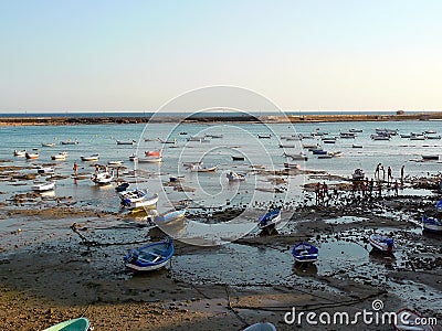 Fishing boats on the beach of La Caleta in the bay of the capital of Cadiz, Andalusia. Spain. Editorial Stock Photo