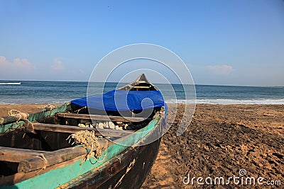 Fishing boats docked on a beach Stock Photo