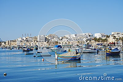 Fishing boats in european Marsaxlokk town in Malta Stock Photo