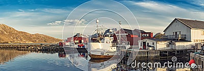 Fishing boats in harbor at midnight sun in Northern Norway, Lofoten Island, Fredvang, Norway Editorial Stock Photo