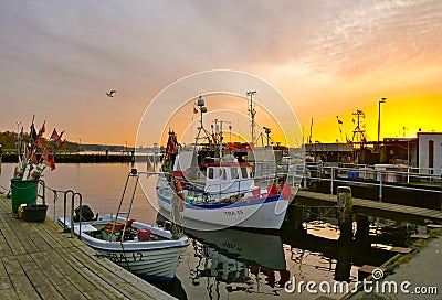Fishing boats in the harbor at sunset in winter.TravemÃ¼nde, Schleswig-Holstein, Germany, Europe Editorial Stock Photo