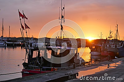 Fishing boats in the harbor at sunset in winter.TravemÃ¼nde, Schleswig-Holstein, Germany, Europe Editorial Stock Photo