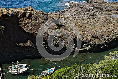 Fishing boats in the harbor. View from above. In the village of Framura, near the Cinque Terre a blue sea Stock Photo