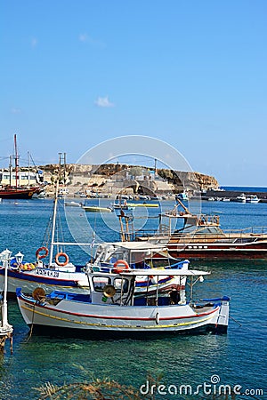 Fishing boats in Hersonissos harbour. Editorial Stock Photo