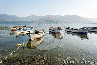 Fishing boats along the shore of Lake Bafa in Turkey Stock Photo