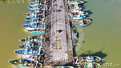 Fishing boats in the port of Mazara del Vallo in Sicily, aerial overhead view from drone Editorial Stock Photo